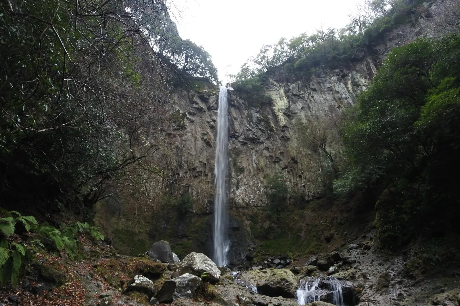 Higashi-Shiiya Falls, a single fall of water at the back of a space ringed by sheer rock walls